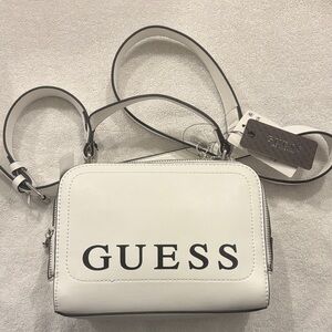 One of the most saw after Guess hand bags ever. White  casual bags with strap.